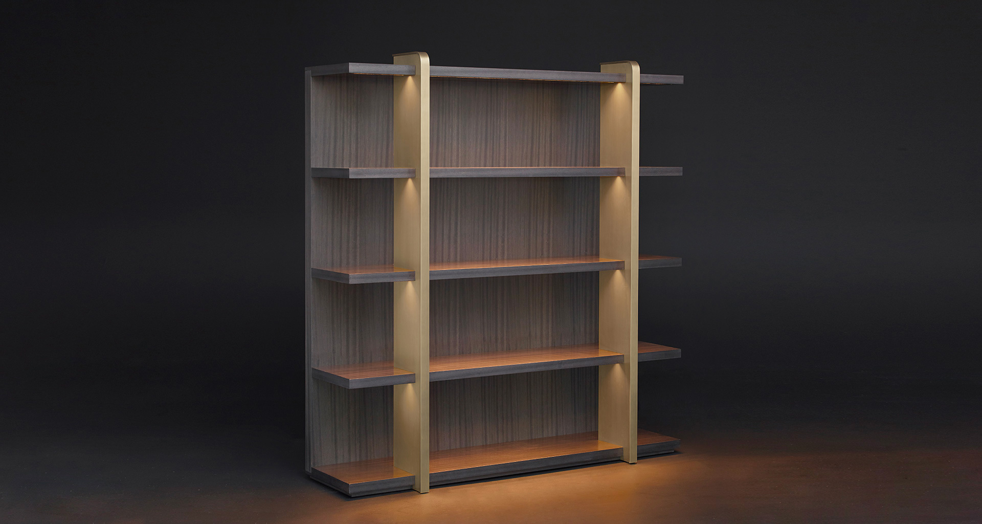 Nisha is a wooden bookcase with bronze supports from the Promemoria's Night Tales collection | Promemoria