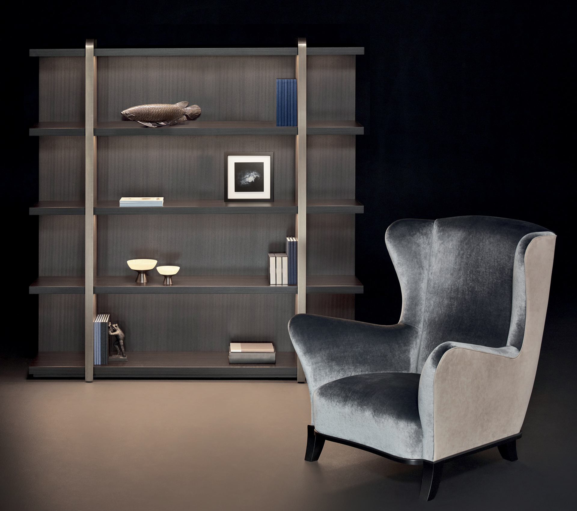 Nisha is a wooden bookcase with bronze supports from the Promemoria's Night Tales collection | Promemoria
