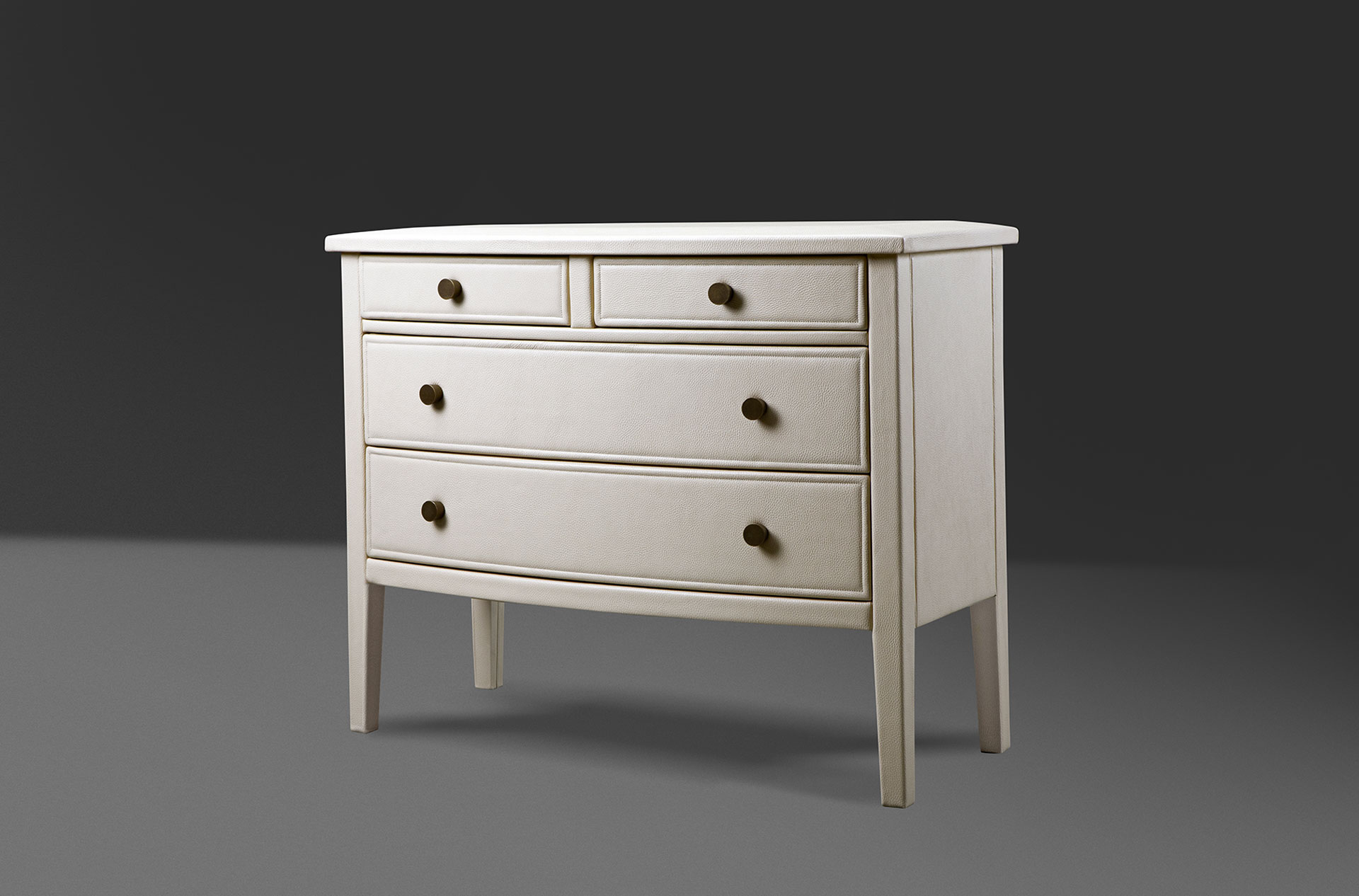 Cassettiera '700 is a wooden chest of drawers covered in leather or galuchat with bronze knobs, from Promemoria's catalogue | Promemoria