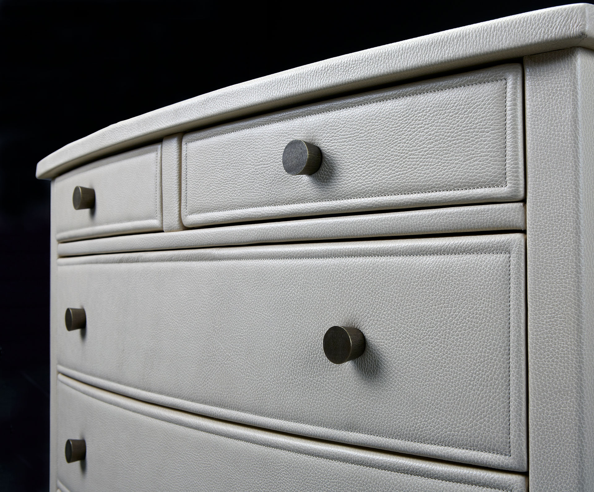 Cassettiera '700 is a wooden chest of drawers covered in leather or galuchat with bronze knobs, from Promemoria's catalogue | Promemoria