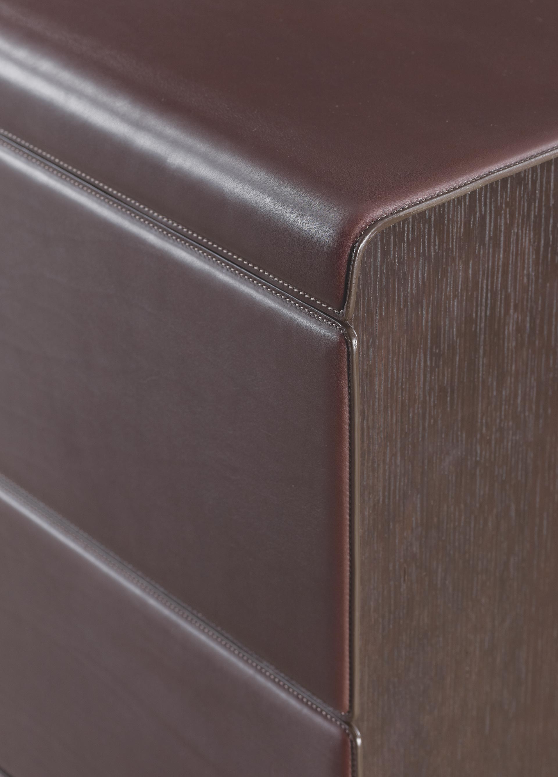 Orione is a wooden chest of drawers covered in leather, from Promemoria's catalogue | Promemoria