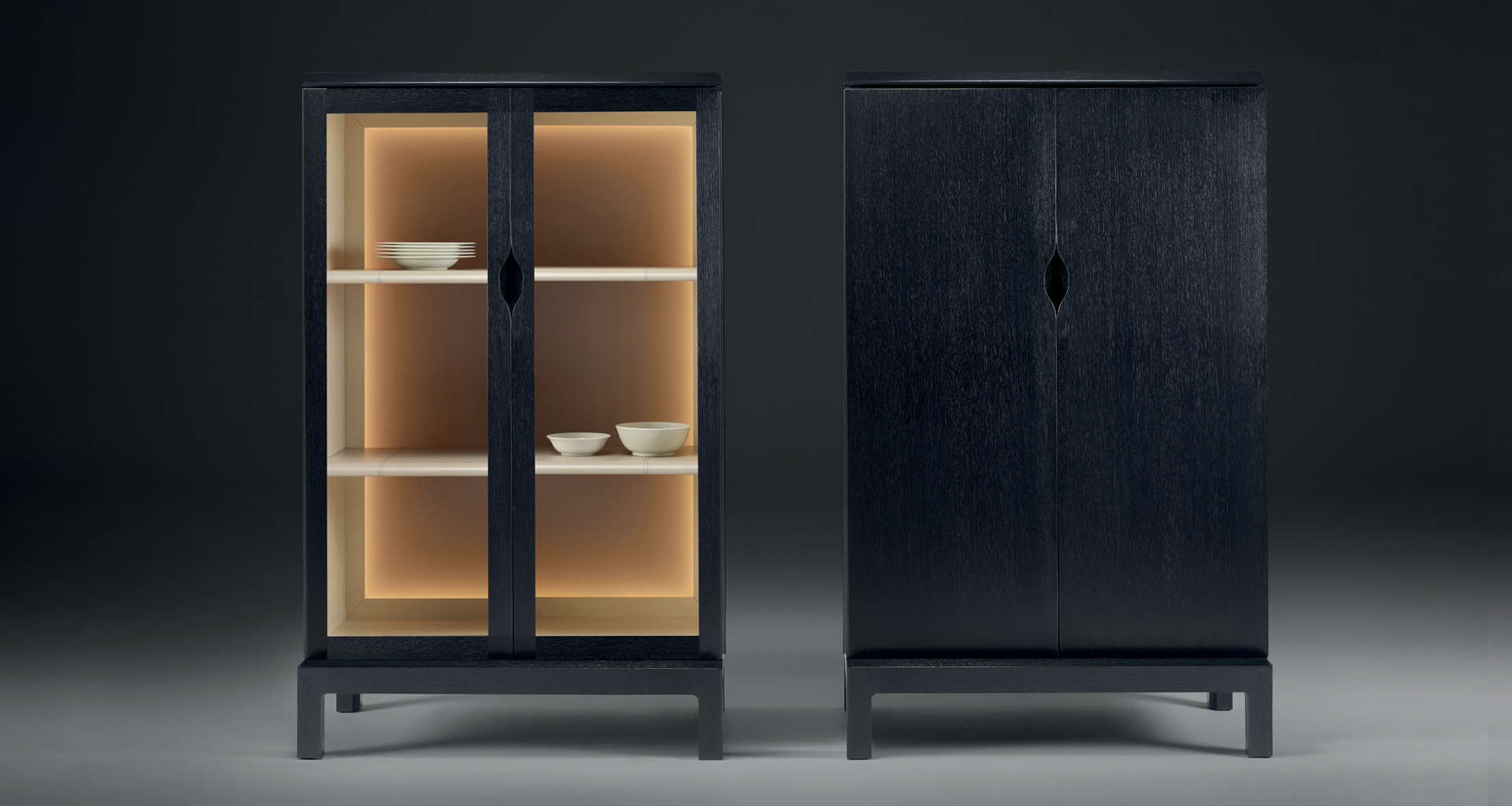 Laos is a wooden cabinet with a recessed handle and wooden or glass doors from Promemoria's Indigo Tales collection | Promemoria