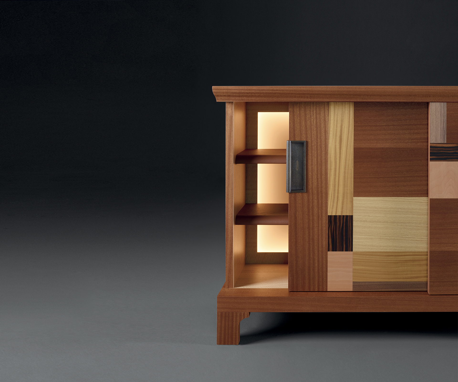Inside of Oolong, a low wooden cabinet with sliding doors, patchwork inlay with leather shelv from Promemoria's catalogue | Promemoria