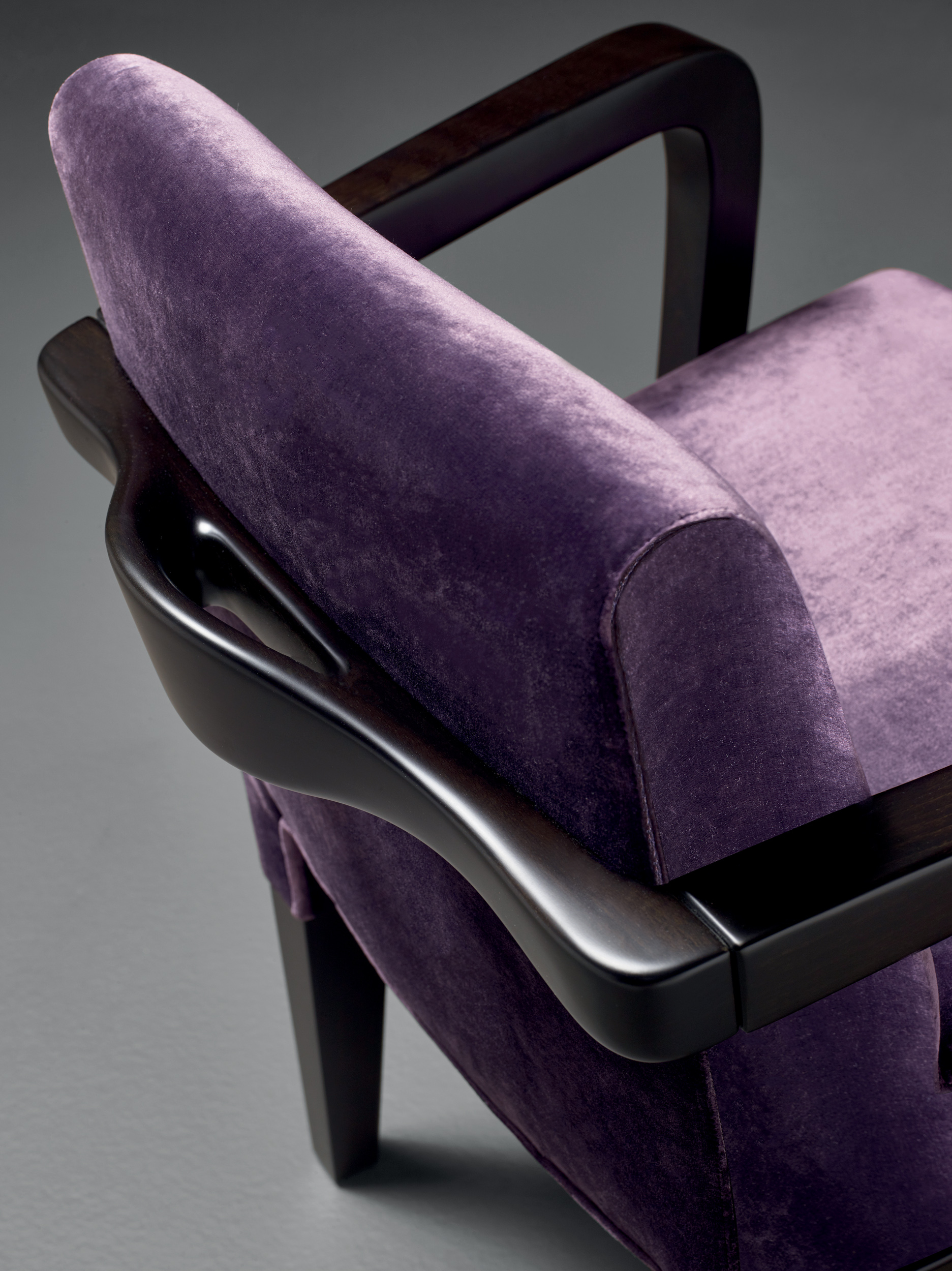 Handle detail of Brigitta Short, a wooden dining chair covered in fabric or leather, from Promemoria's catalogue | Promemoria