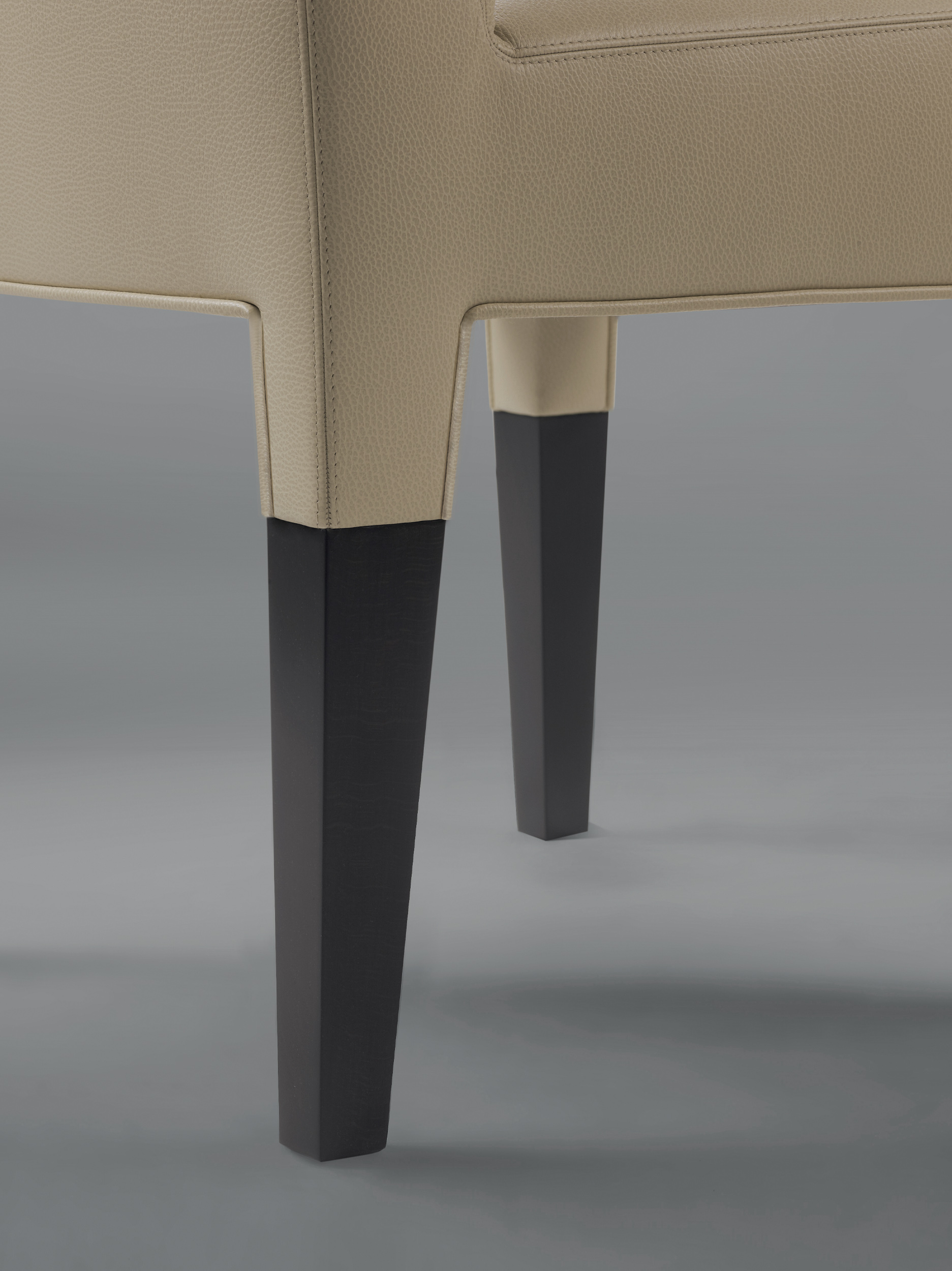 Brigitta Short is a wooden dining chair covered in fabric or leather, with a handle on the backrest, from Promemoria's catalogue | Promemoria