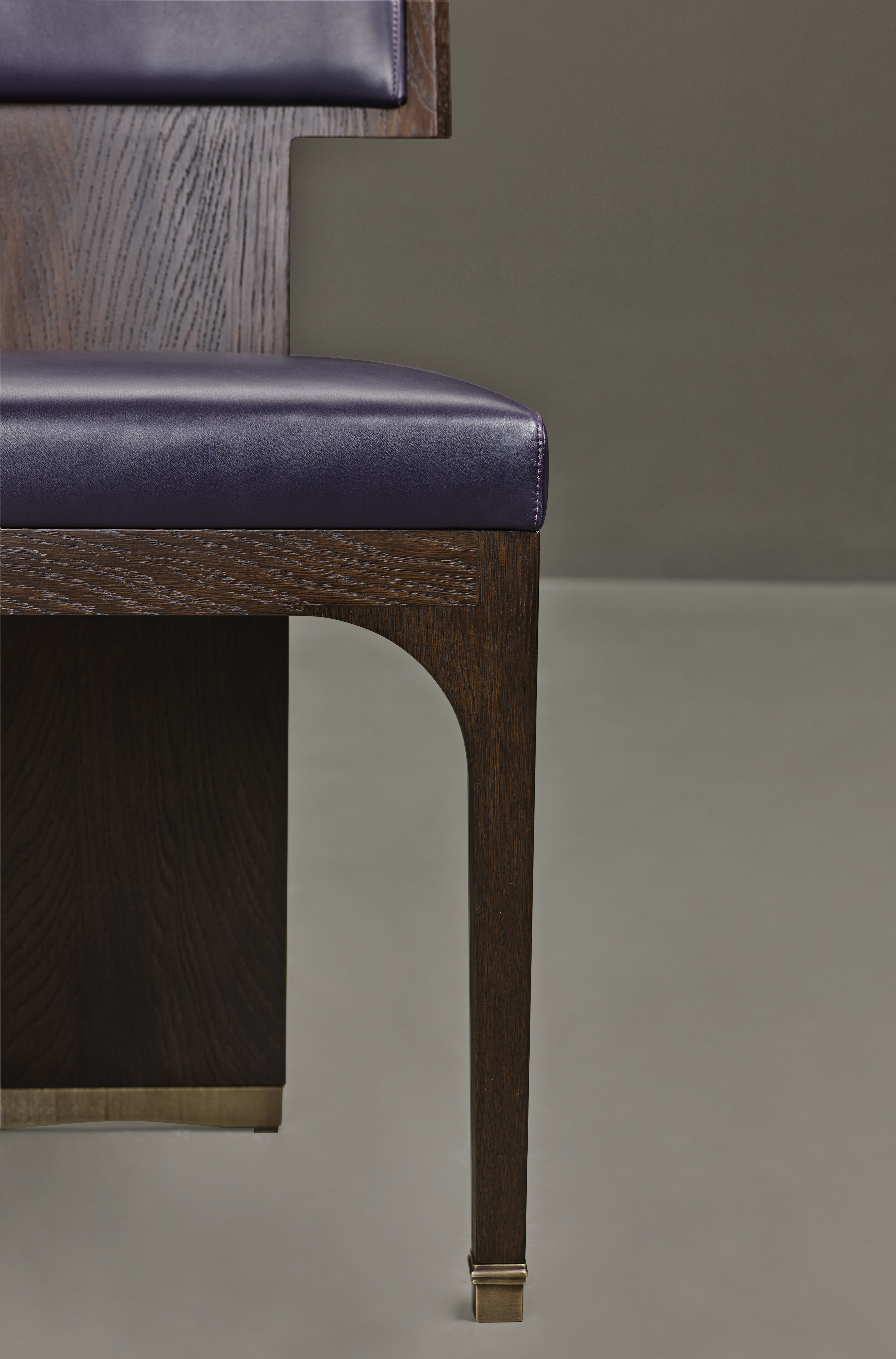Detail of DC Chair, a wooden dining chair with leather seat and back and bronze feet, from Promemoria's The London Collection | Promemoria