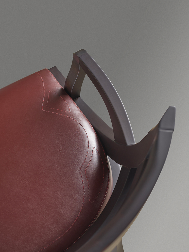 Judith is a wooden dining chair with a bronze detail on the armrest, from Promemoria's catalogue | Promemoria