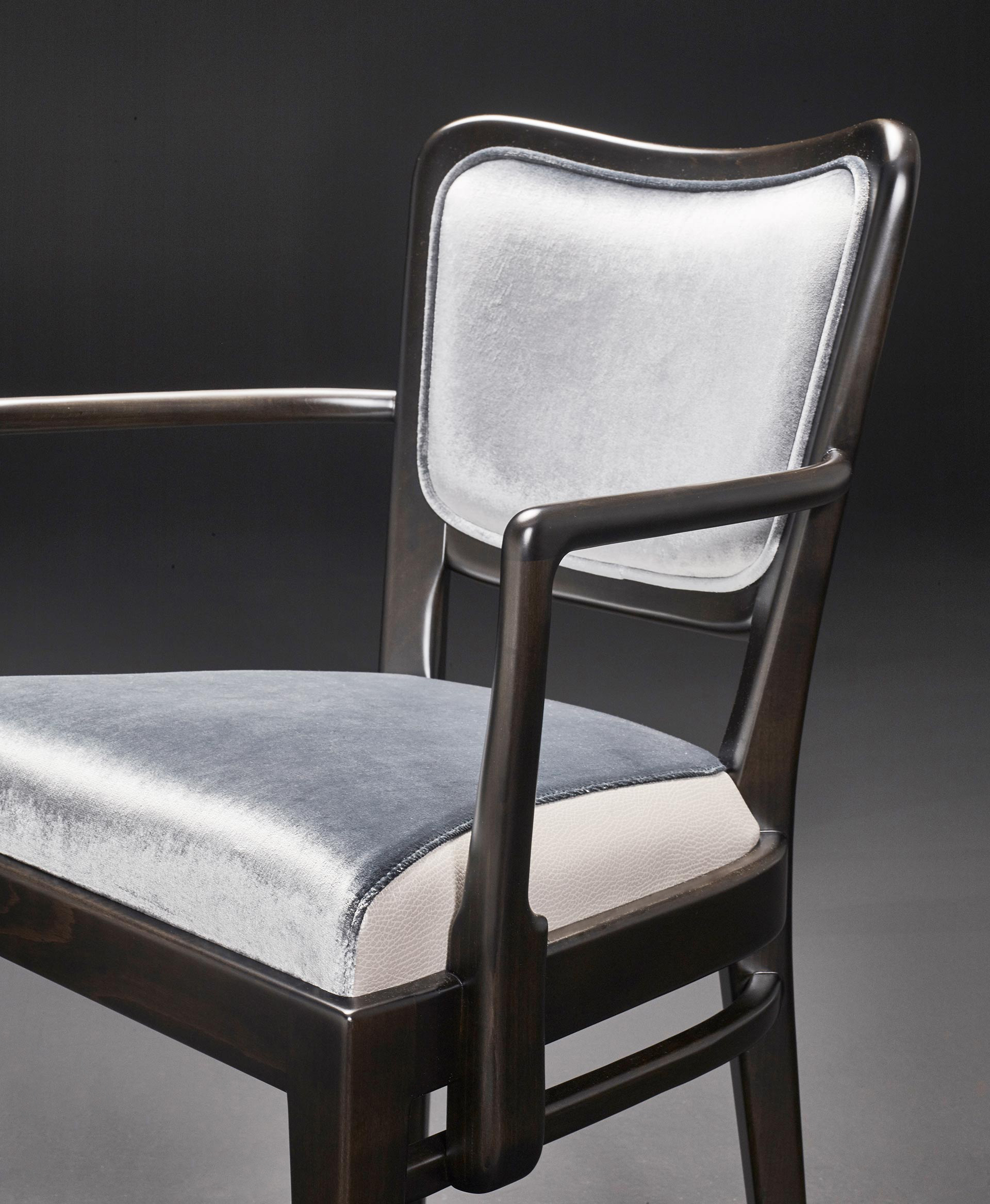 Detail of Pepita, a wooden dining chair with fabric or leather seat, from Promemoria's catalogue | Promemoria