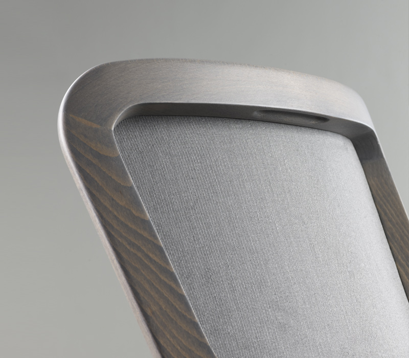 Detail of Pepita, a wooden dining chair with fabric or leather seat, from Promemoria's catalogue | Promemoria