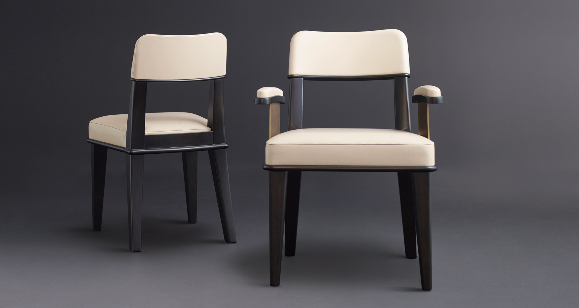 Vespertine is a wooden dining chair with leather seat and back and with or without armrests with bronze details, from Promemoria's Night Tales collection | Promemoria