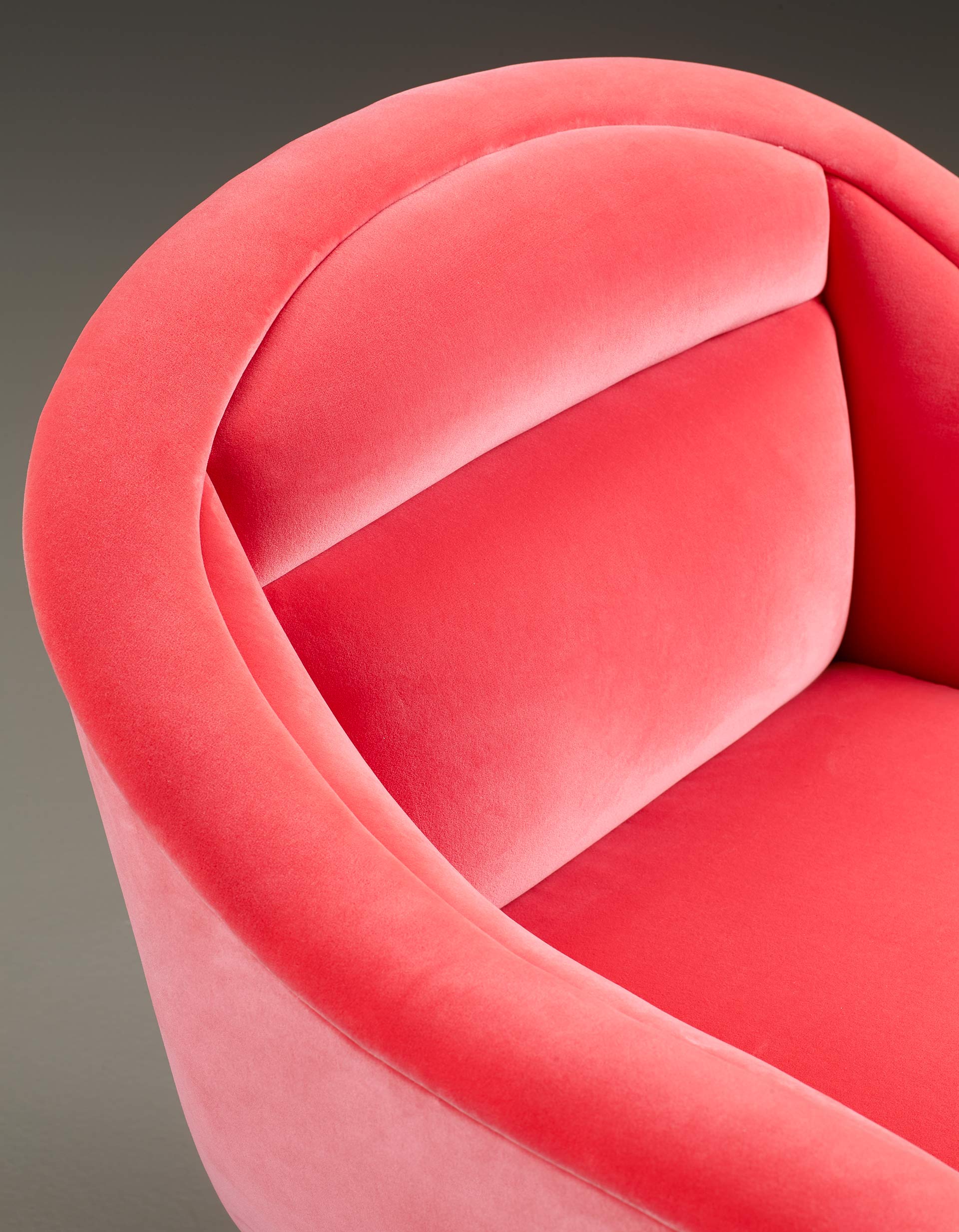 Detail of Vittoria, a wooden chair covered in fabric or leather with a bronze handle on the back, from Promemoria's catalogue | Promemoria