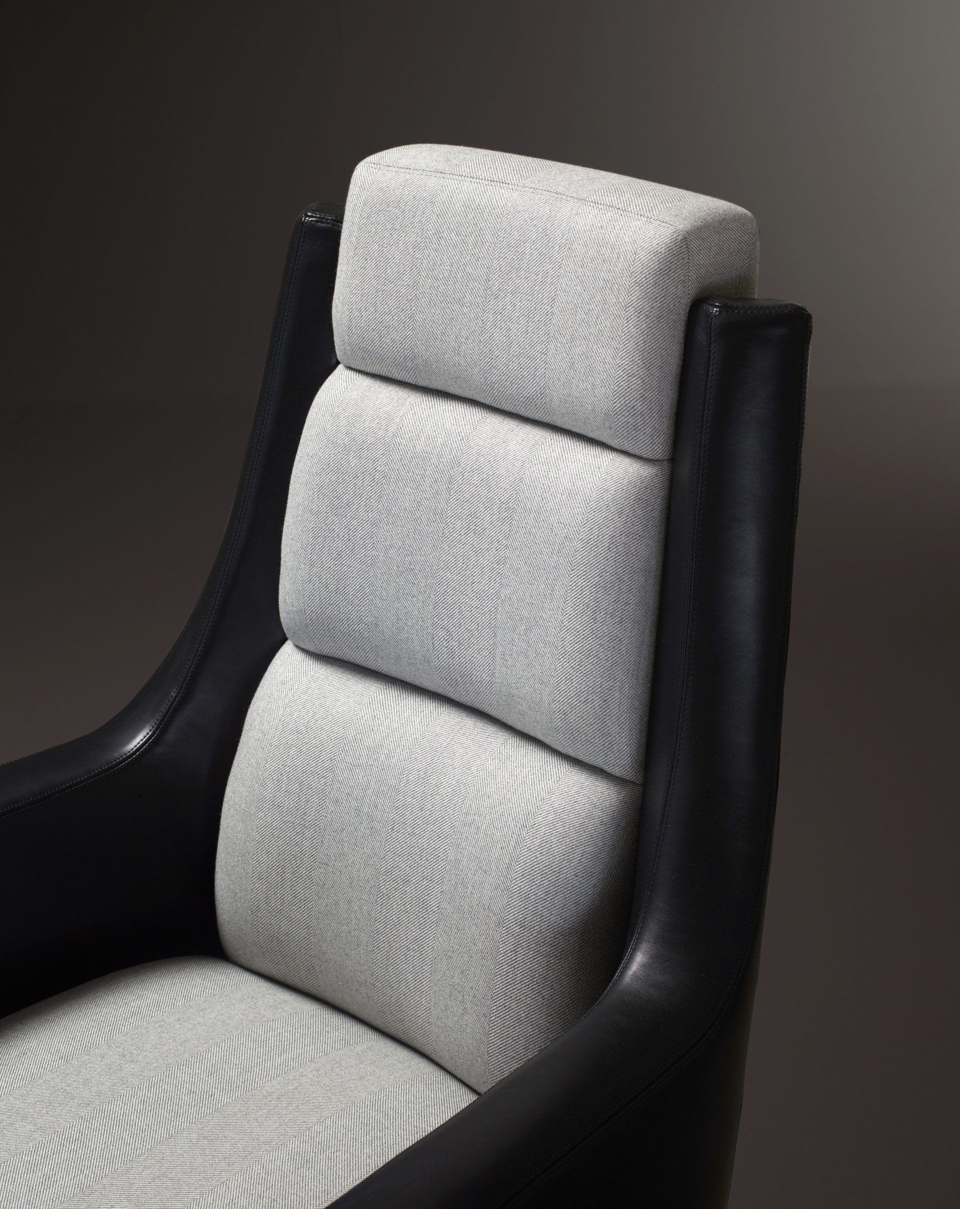 Detail of Kate, an office chair with a metal base covered in leather and fabric, from Promemoria's Amaranthine Tales collection | Promemoria