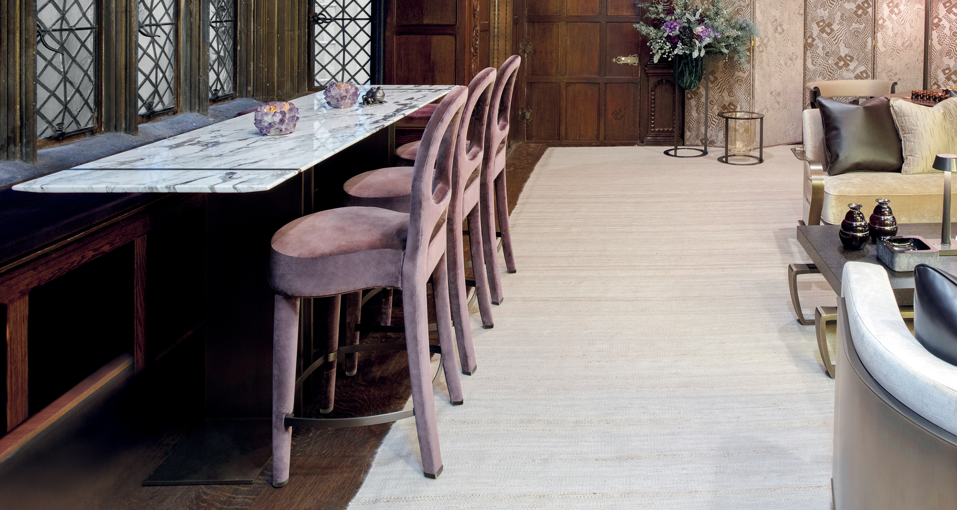 Bilou Bilou is a wooden stool with fabric or leather seat and bronze footrest and with the same aesthetic of the Bilou Bilou chair, from Promemoria's catalogue | Promemoria