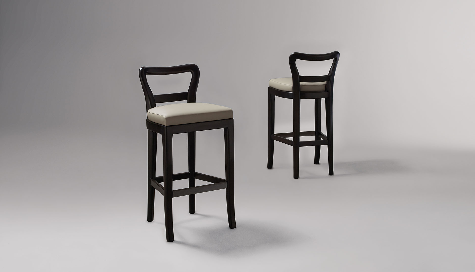 Sofia is a wooden stool with seat covered in fabric or leather, from Promemoria's catalogue | Promemoria
