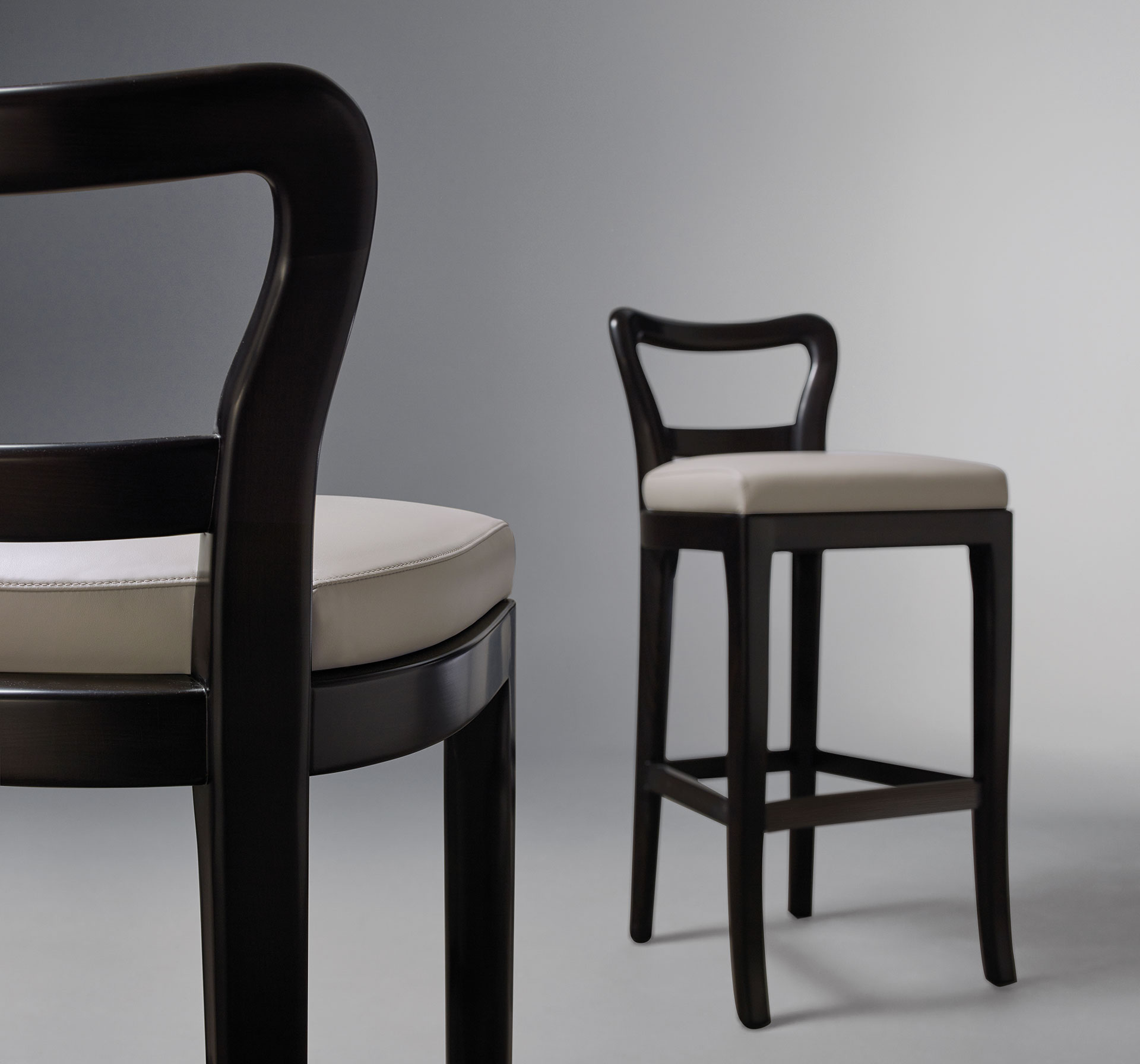 Sofia is a wooden stool with seat covered in fabric or leather, from Promemoria's catalogue | Promemoria