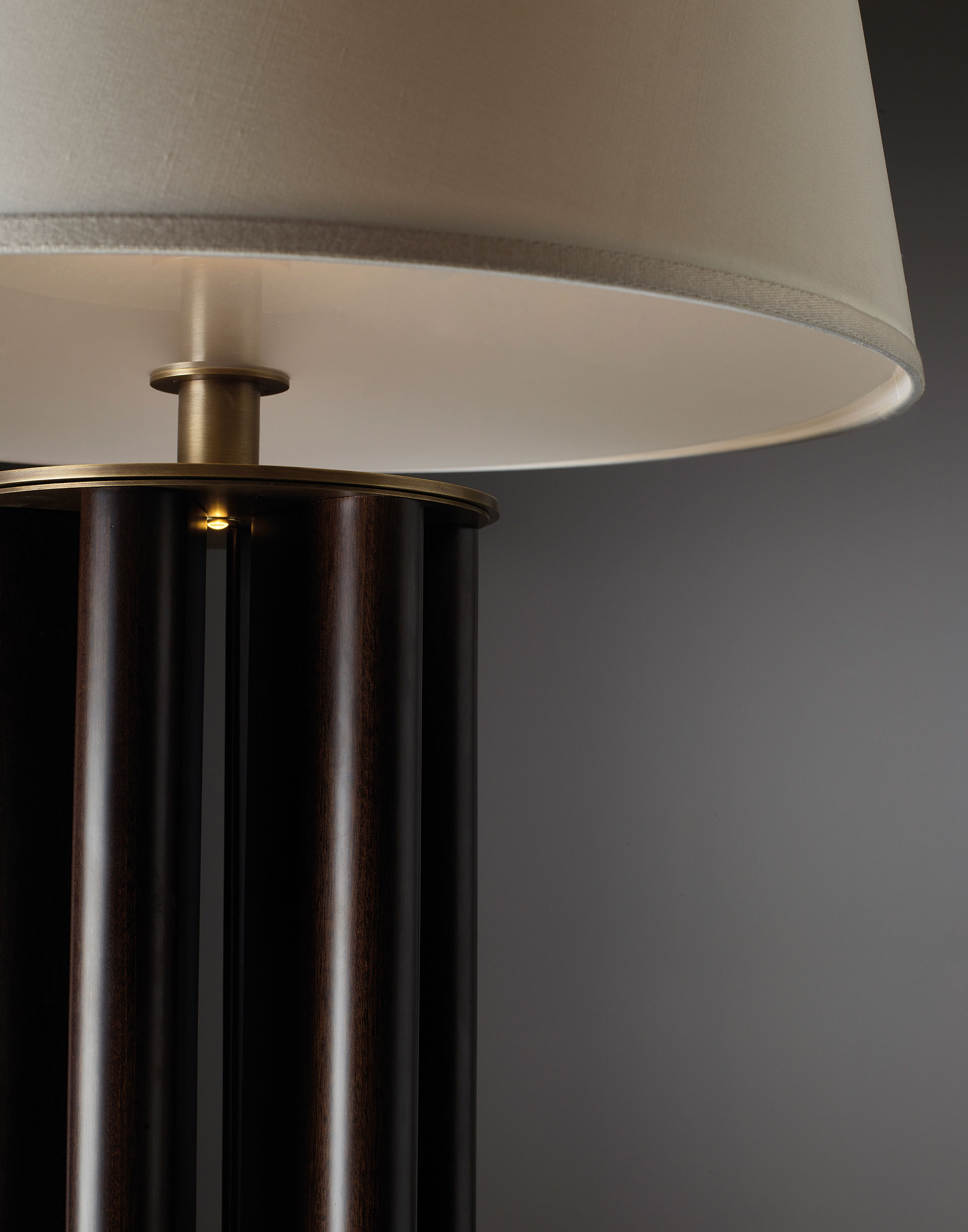 Detail of Clori, a floor LED lamp with leather or wooden structure, bronze base and details and linen, cotton or silk with handmade edge, from Promemoria's Amaranthine Tales collection | Promemoria