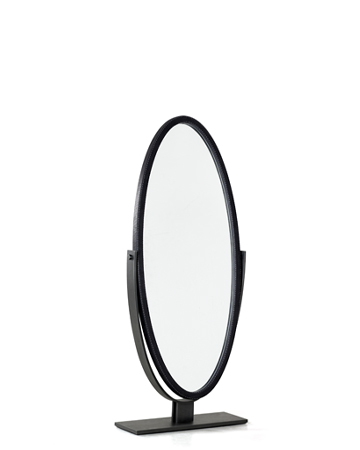 Ingrid is an elliptical revolving mirror with a bronzed metal base, from the Promemoria's catalogue | Promemoria