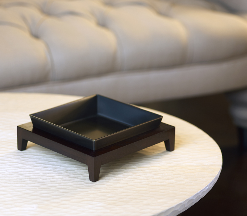 Santos are a wooden umbrella stand, flowerpot, wastepaper bin and tray, covered in leather, from Promemoria's catalogue | Promemoria
