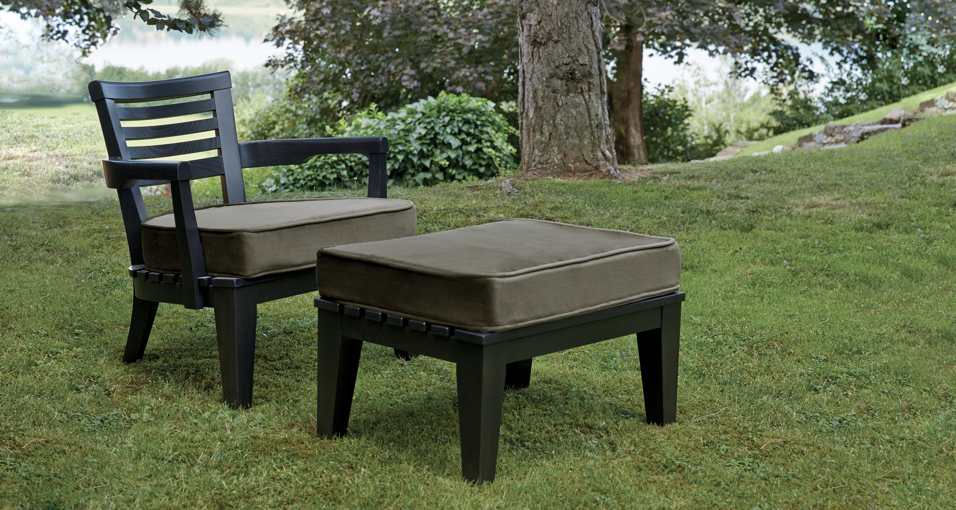 Varenna is a veranda wooden pouf-small table with fabric cushion, from Promemoria's outdoor catalogue | Promemoria