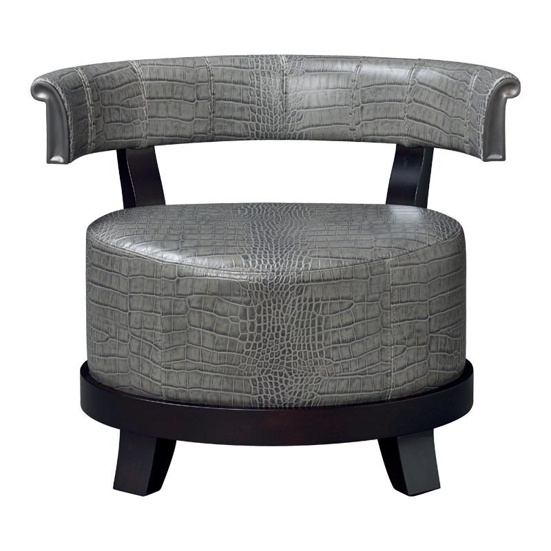 Chelsea is a wooden armchair covered in fabric or leather with bronze details, from Promemoria's catalogue | Promemoria