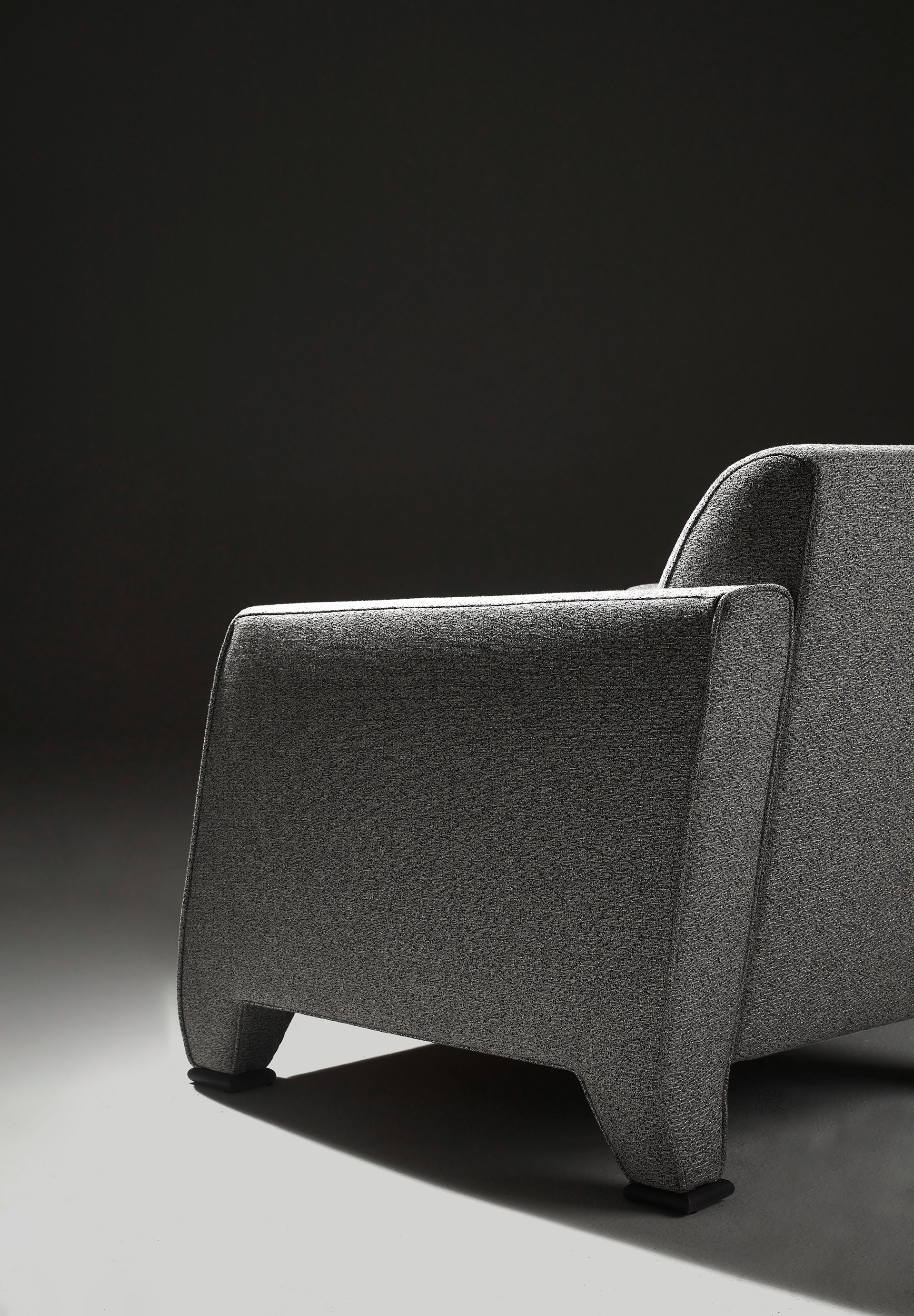 DimenMartini Nini, an armchair with fabric or leather covering and seat cushions and bronze feet, fsions of Martini Nini, an armchair with fabric or leather covering and seat cushions and bronze feet, from Promemoria's Indigo Tales collection | Promemoria