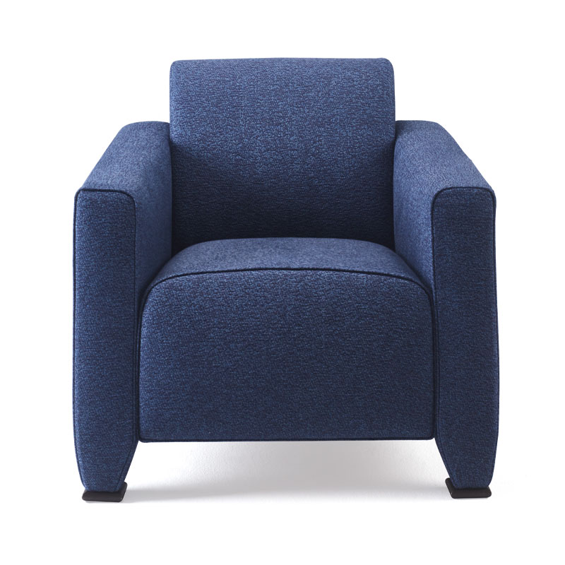 Martini Nini is an armchair with fabric or leather covering and seat cushions and bronze feet, from Promemoria's Indigo Tales collection | Promemoria