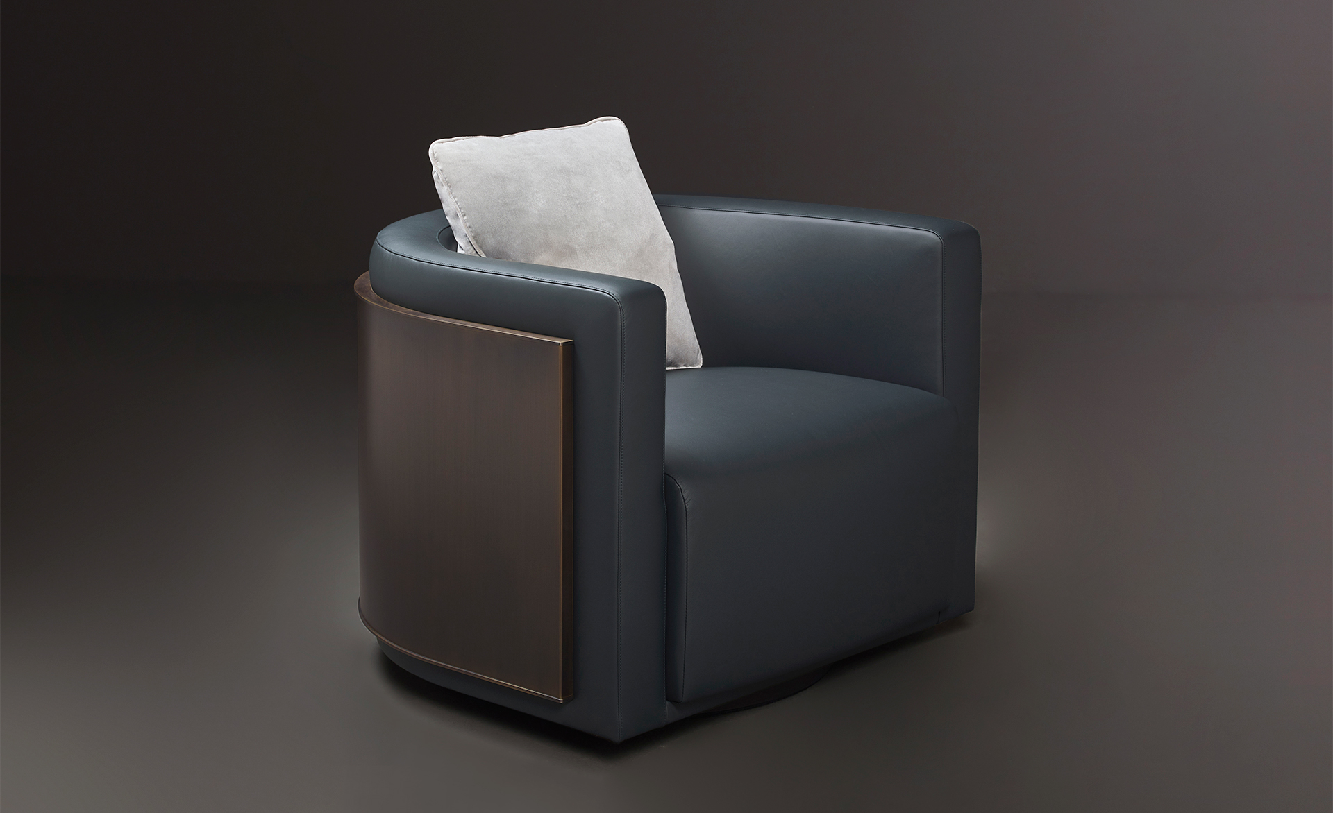 Pervinca is a swivel bronze armchair with a wooden base and fabric covering, from Promemoria's Amaranthine Tales collection | Promemoria