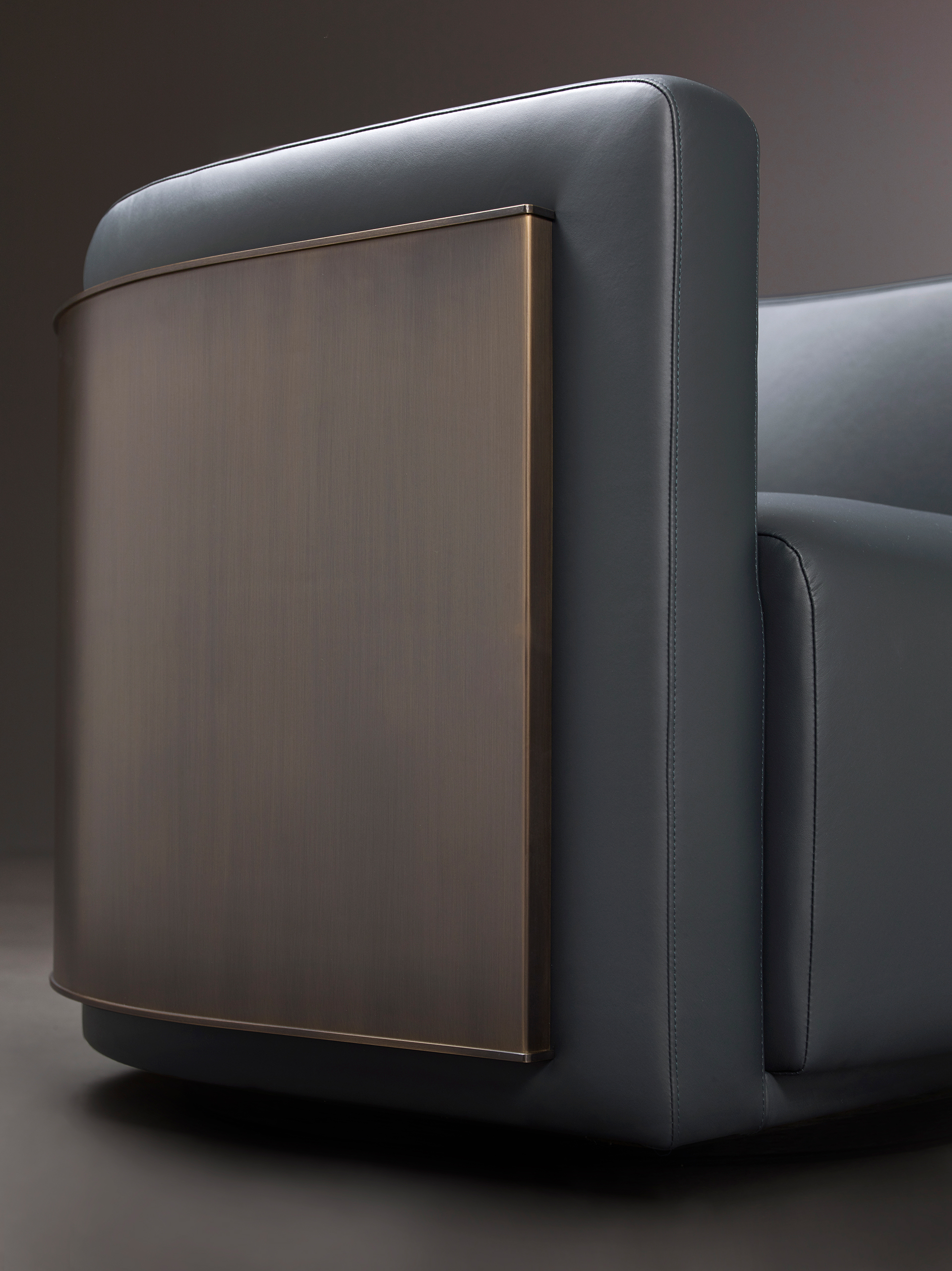 Pervinca is a swivel bronze armchair with a wooden base and fabric covering, from Promemoria's Amaranthine Tales collection | Promemoria