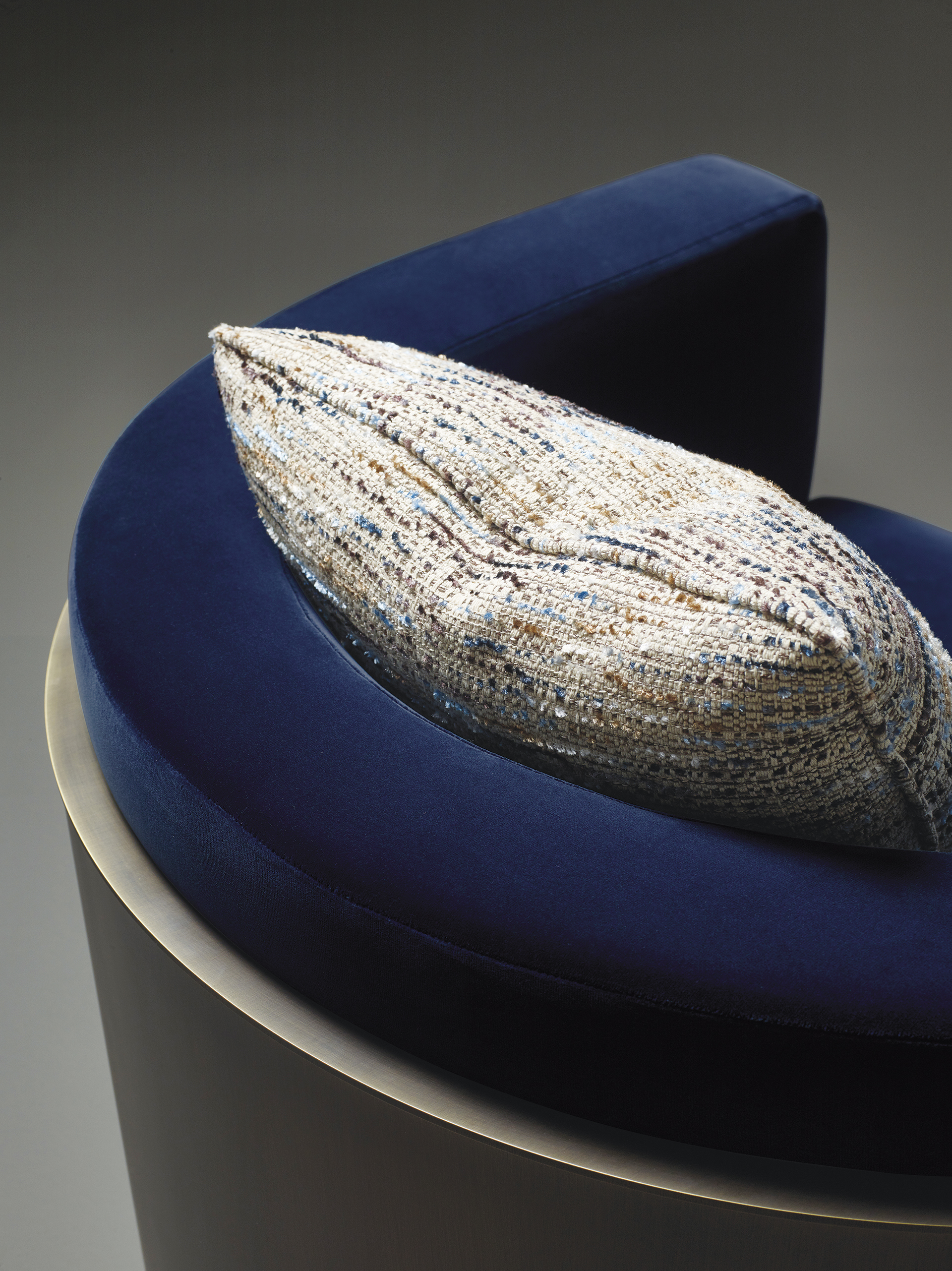 Pervinca is a swivel bronze armchair with a wooden base and fabric covering, from Promemoria's Amaranthine Tales collection | Promemoria