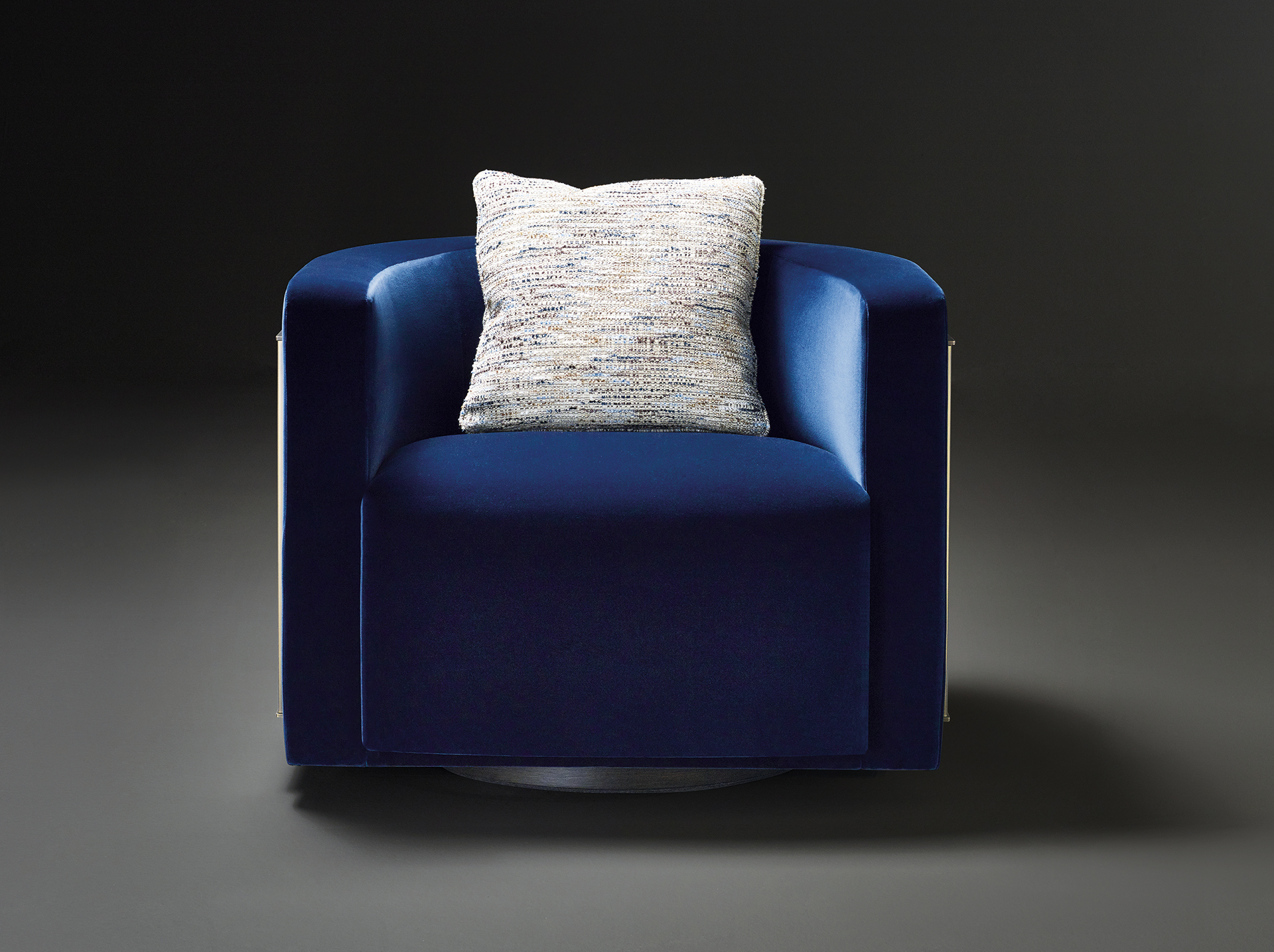 Pervinca is a swivel bronze armchair with a wooden base and fabric covering, from Promemoria's Amaranthine Tales collection | Promemoria