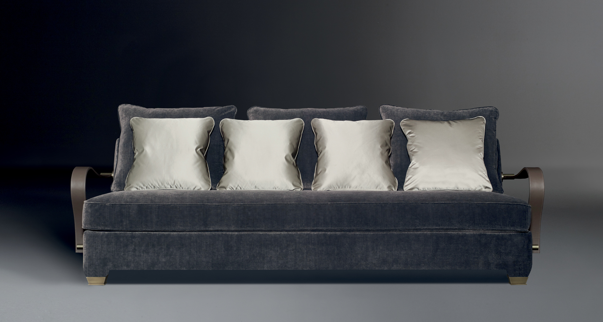 Augusto is a modular and customizable sofa, available with bronze or leather armrests and bronze feet, from Promemoria catalogue | Promemoria