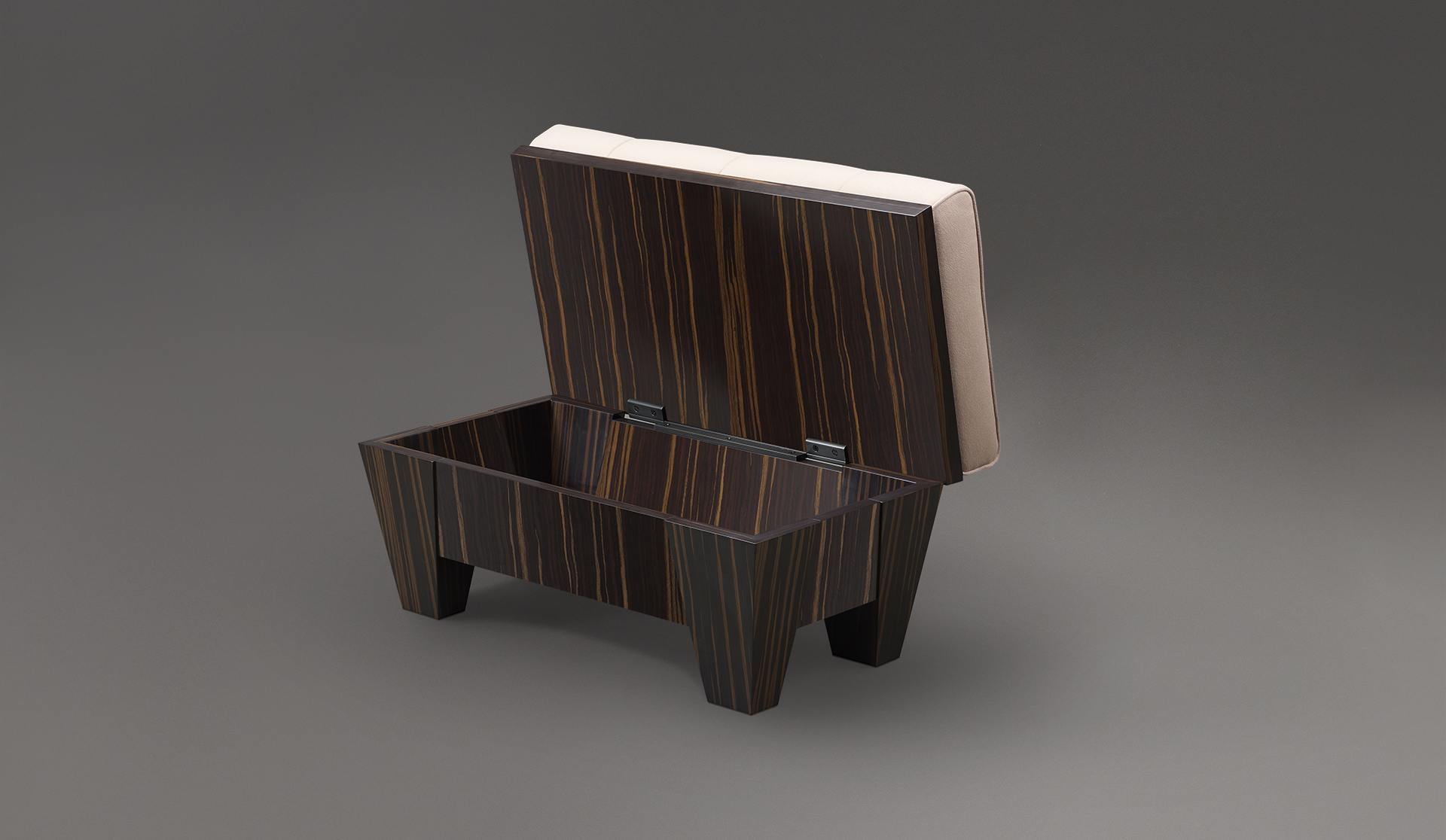 Open Gertrude, a wooden pouf container covered in capitonnè fabric, from Promemoria's Lake Tales collection | Promemoria