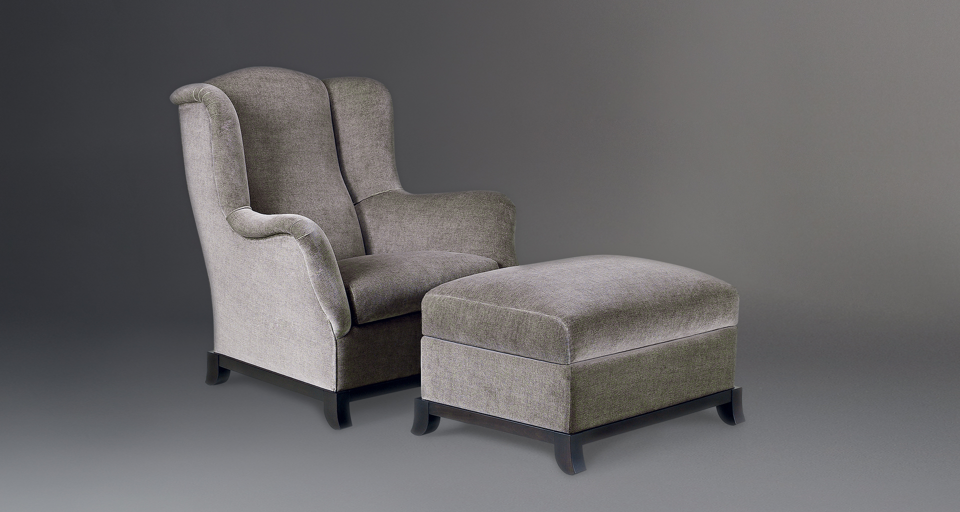 Madame A is a wooden pouf covered in fabric or leather, from Promemoria's catalogue | Promemoria