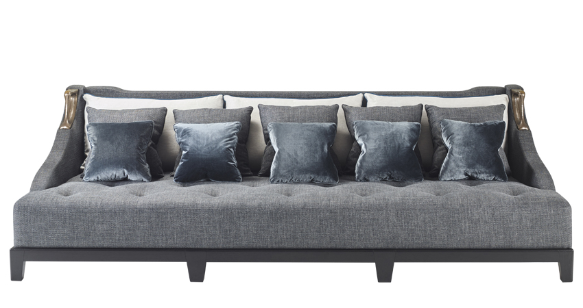 Albert is a wooden sofa covered in fabric with two bronze handles on the sides, from Promemoria's catalogue | Promemoria