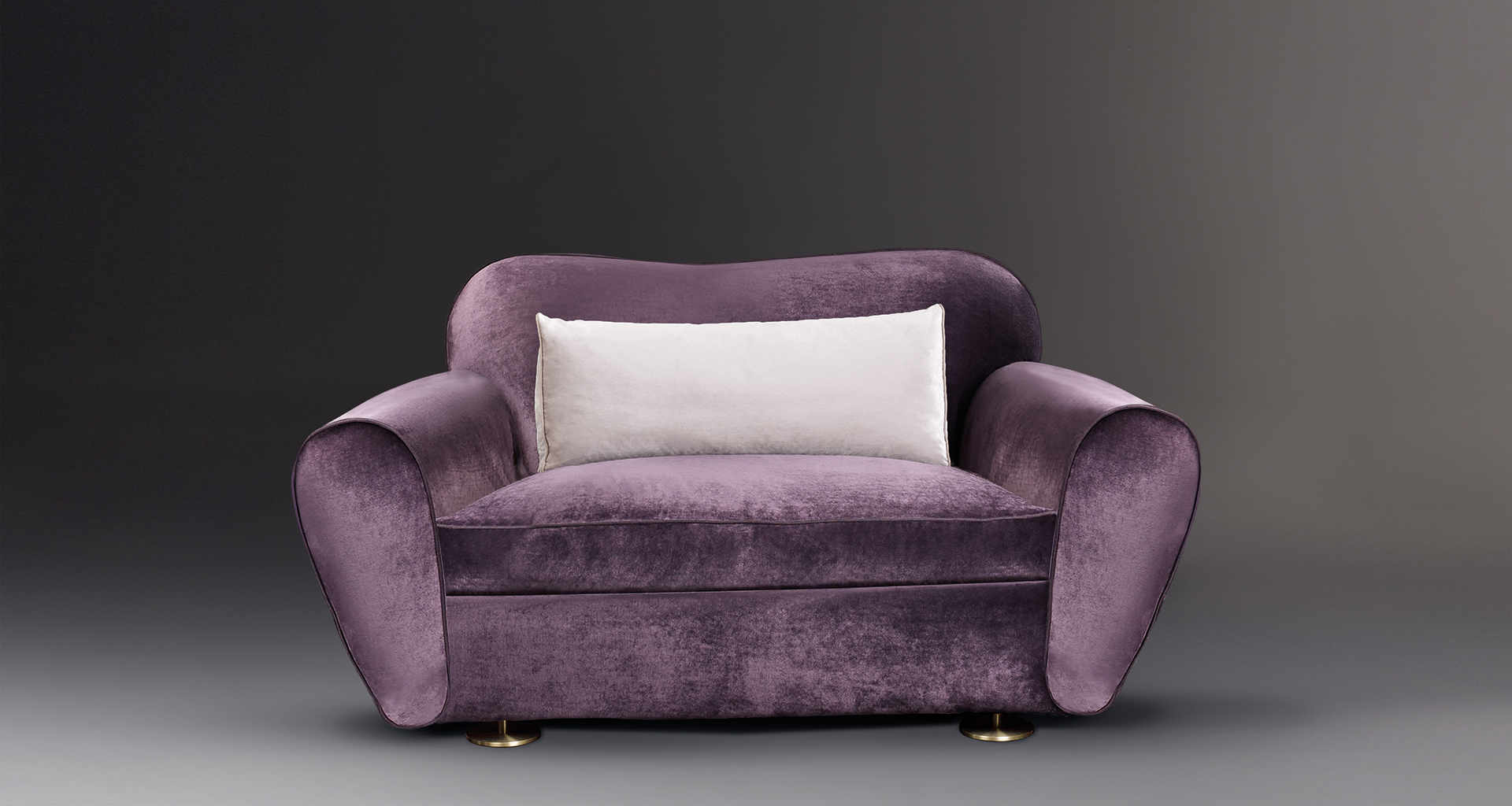 Artù is a sofa covered in fabric with bronze feet, from Promemoria's catalogue | Promemoria