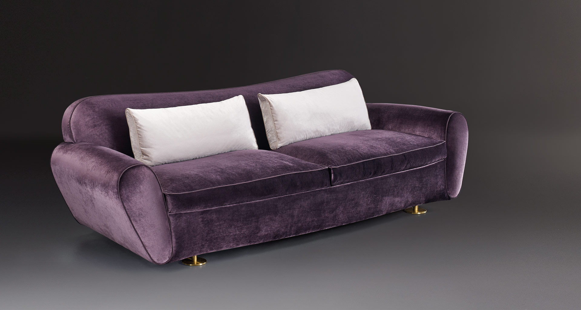 Artù is a sofa covered in fabric with bronze feet, from Promemoria's catalogue | Promemoria