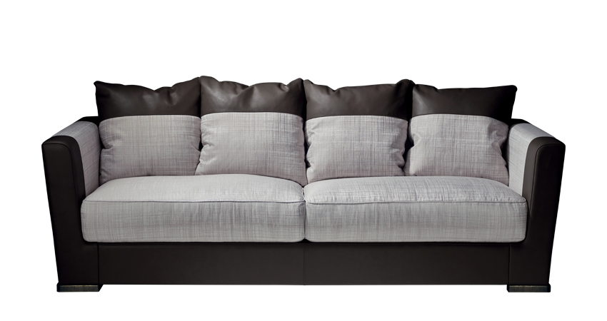 Dolce Vita is a sofa covered in fabric with leather details and bronze feet, from Promemoria's catalogue | Promemoria