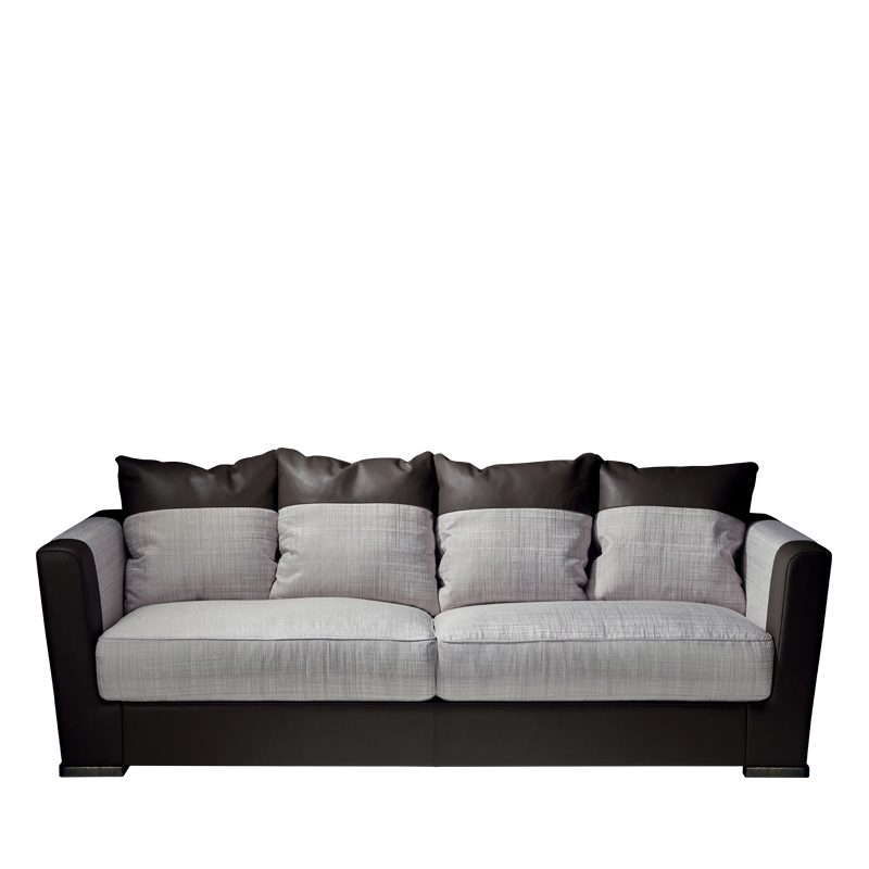Dolce Vita is a sofa covered in fabric with leather details and bronze feet, from Promemoria's catalogue | Promemoria