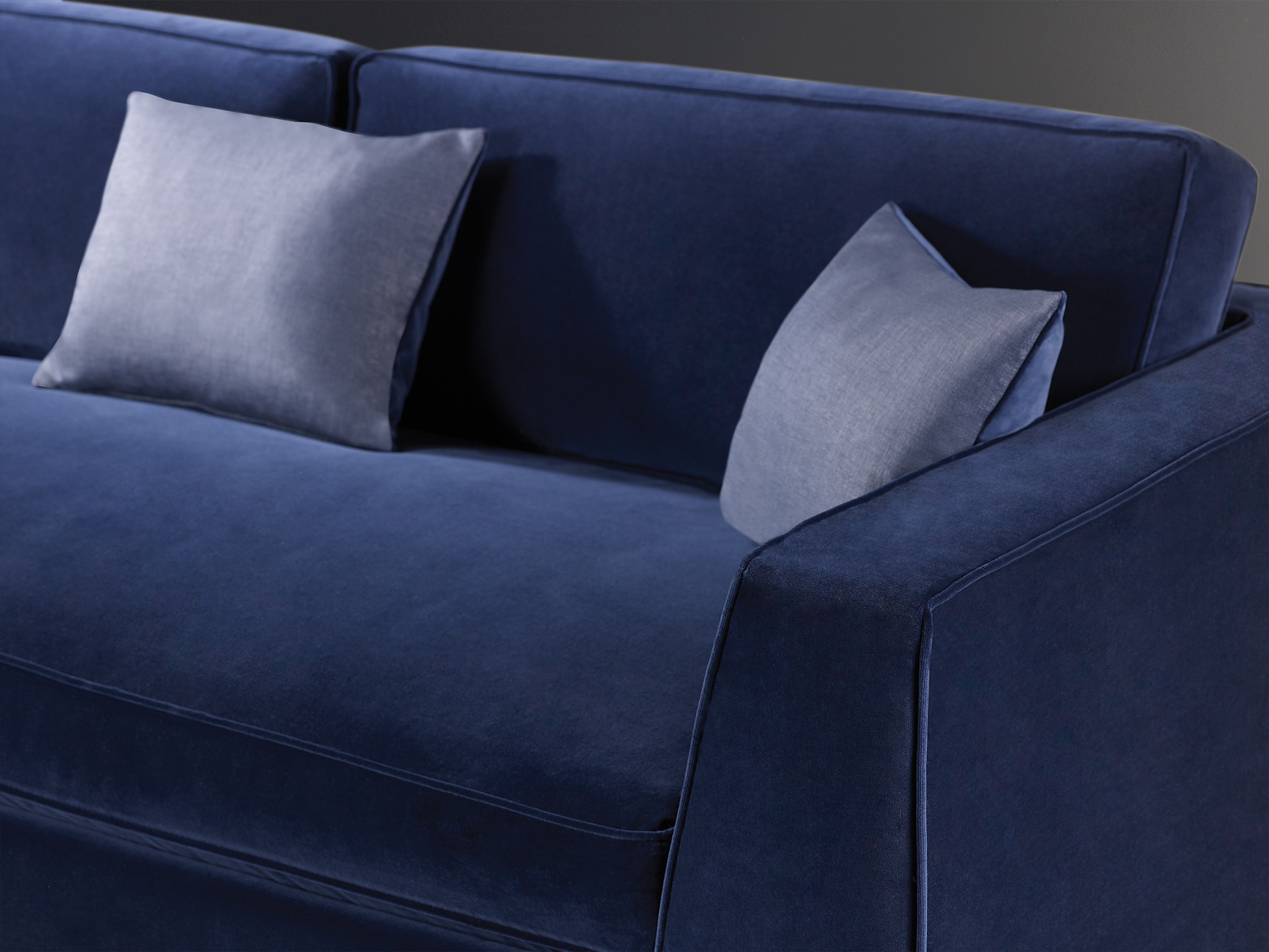 Detail of Oscar, a sofa completely covered in removable fabric, from Promemoria's catalogue | Promemoria
