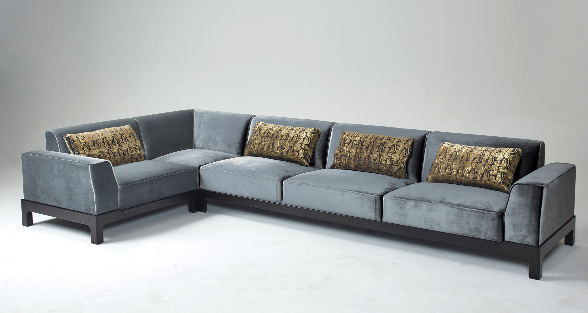 Pullman is a wooden sofa with fabric covering and cushions, from Promemoria's Indigo Tales collection | Promemoria