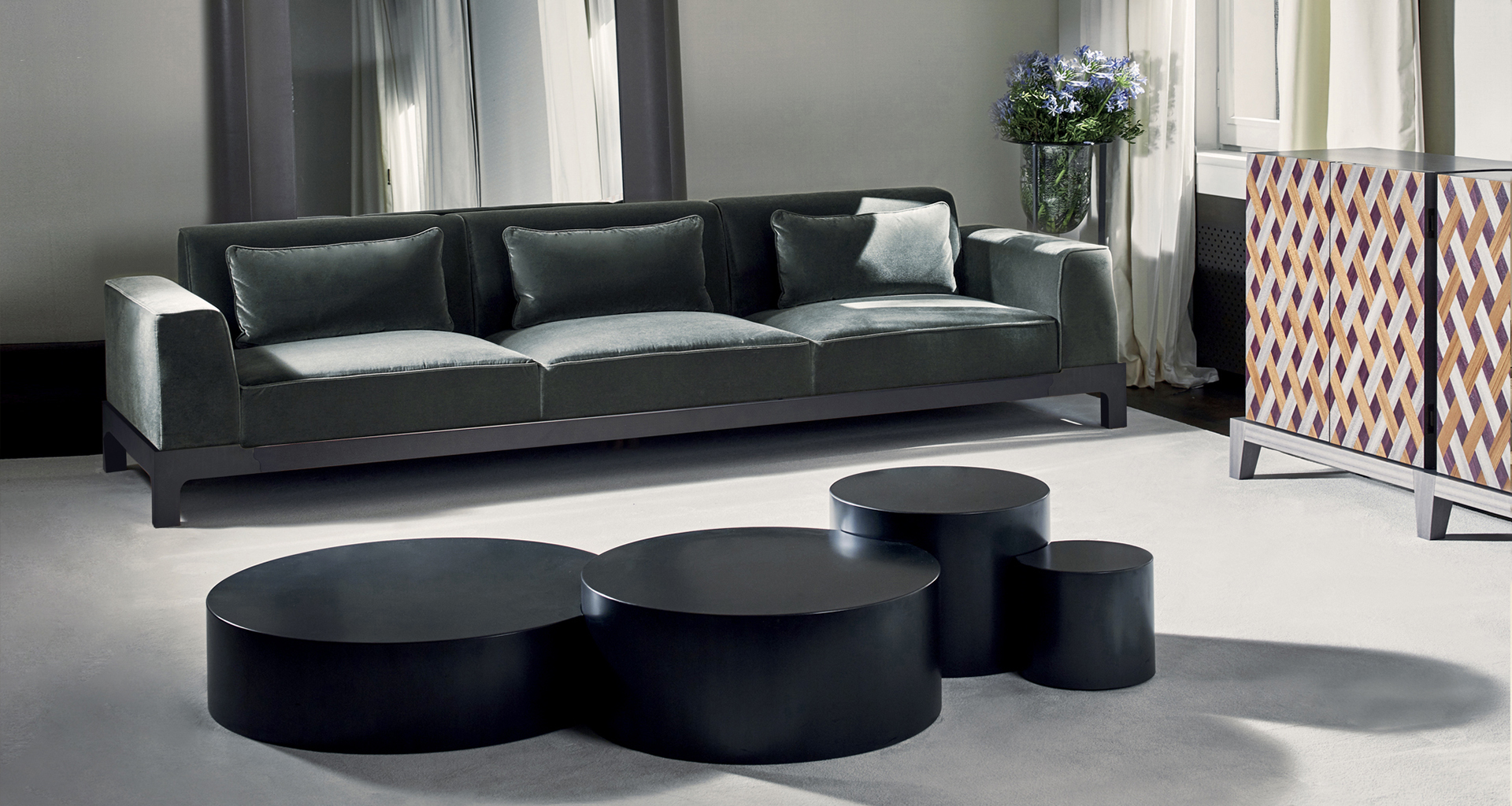 Edon is a bronze coffee table, with four units embedded, from Promemoria's Indigo Tales collection | Promemoria