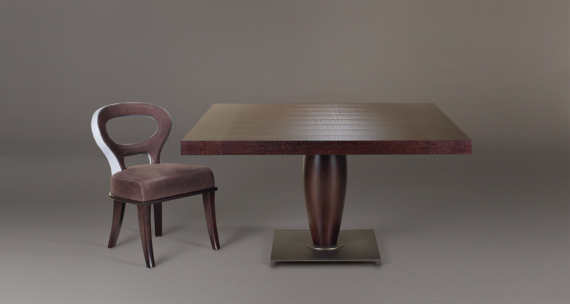 Bassano is an impressive wooden dining table with a bronze base available with inlaid top, from Promemoria's catalogue | Promemoria