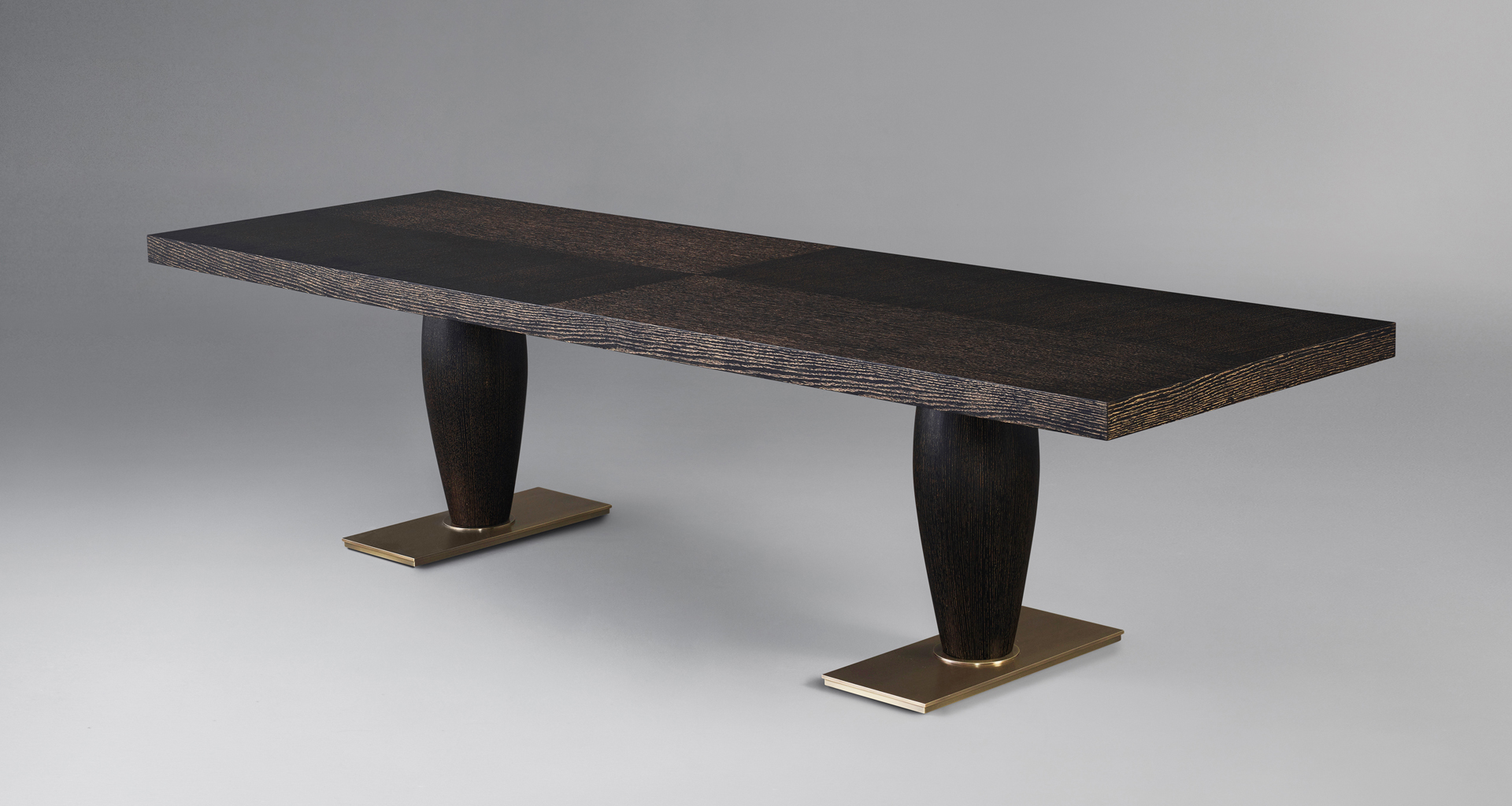 Bassano is an impressive wooden dining table with a bronze base available with inlaid top, from Promemoria's catalogue | Promemoria