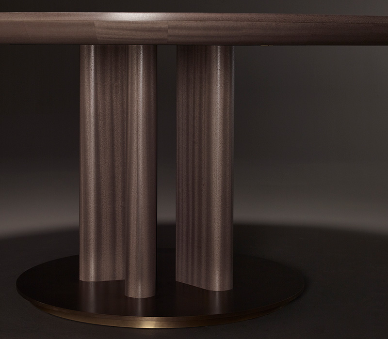 Leg and bronze base detail of Orazio, a wooden and bronze dining table, from Promemoria's Amaranthine Tales collection | Promemoria